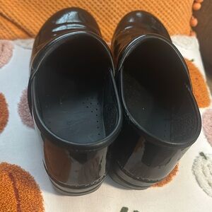 Patent leather black Dansko. Size 40. Used but great condition.